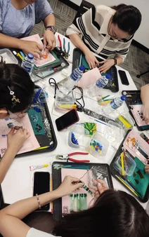 Overhead view of participants creating at a shared table